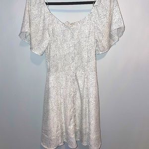 White mini dress with black polka dots